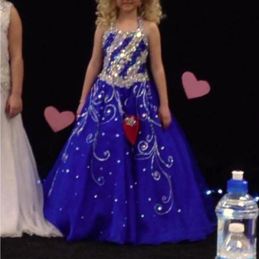 Beautiful Royal Blue Pageant dress. Has over $500 worth of custom stones on it.